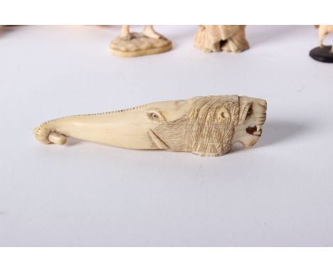 A collection of Ivory Items to include two carved parasol handles, a netsuke, two carved figurines and some boar tusks. Pleas