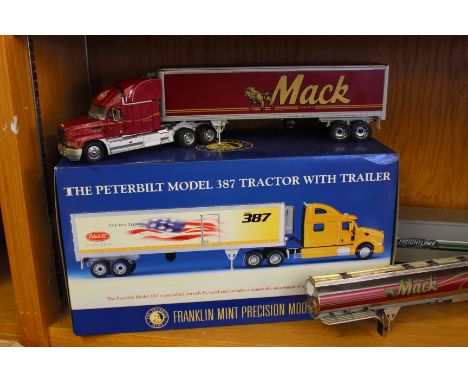 The Franklin Mint Peterbilt Model 387 tractor with trailer (boxed), together with a Mack tractor, trailer & tanker, and a Fre