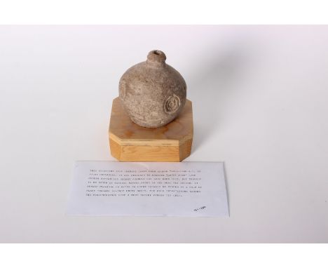 A ceramic Byzantine fire grenade circa 1100AD, designed to contain Greek fire. The four indentations around the circumference
