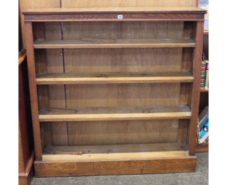 An oak open bookcase and  tile back washstand 