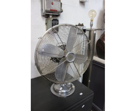A 1930's chrome upright lamp and a vintage metal fan (2) (sold as parts)