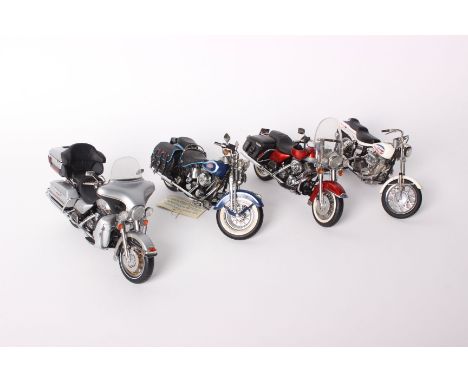 Four Franklin Mint Harley-Davidson 1:10 scale diecast model motorcycles: Electraglide, Heritage Springer, Road king with matc