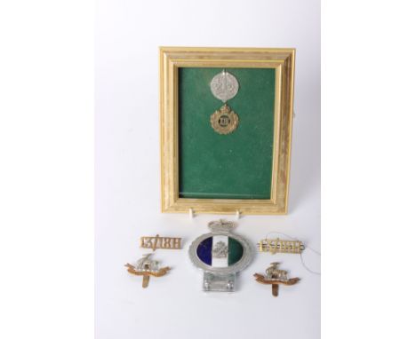 A framed and glazed cap badge of the 13th Hussars 1902-1922 with letter from The Light Dragoons HQ, together with a Northumbe