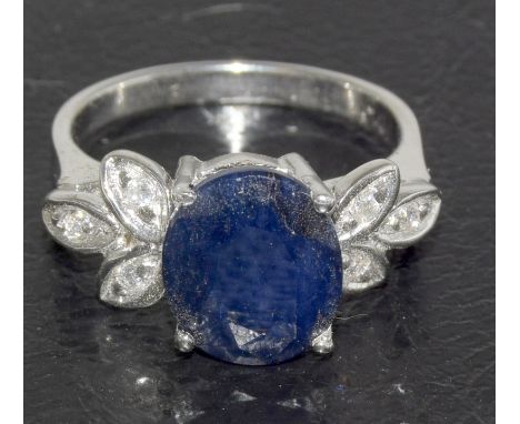 a silver cz and large sapphire set ring. Size M