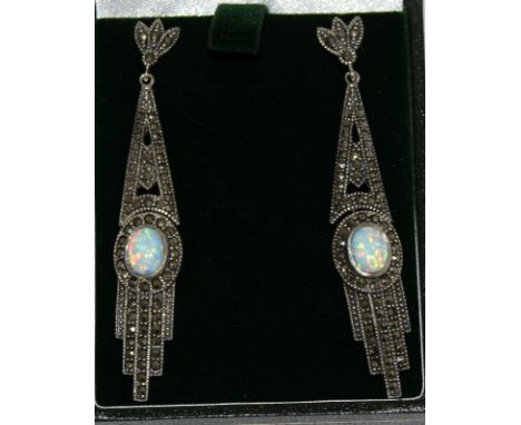 a pair of silver and opal earrings