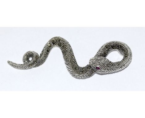 a silver marcasite snake brooch inset with ruby eyes