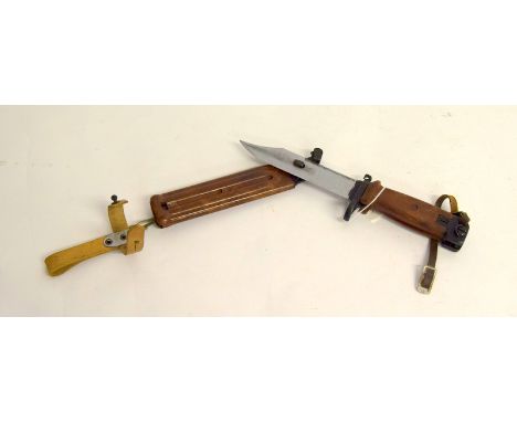 An AKM sawback bayonet / wire cutter in its scabbard having a blade length of 15cms