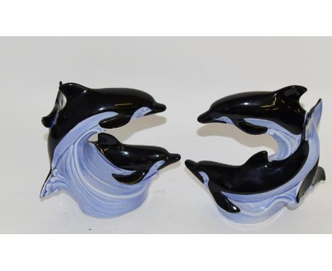 Pair of unusually coloured Poole Pottery dolphin Statues