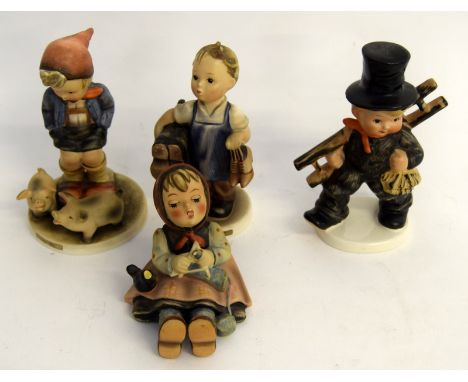 Four Vintage Goebel Hummel figurines. Boots, Farm Boy, Chinmey Sweep and Happy Passtime.