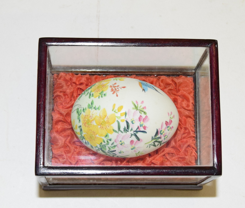 Three chinese hand painted egg display cases, each in a glazed box with