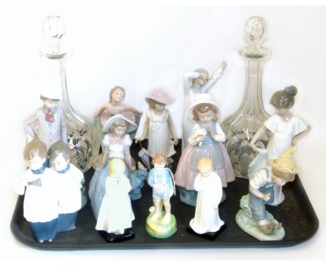 Nine Nao figures, three Doulton figure of Darling, Bedtime and She Loves Me Not, also two glass decanters. Condition reports 