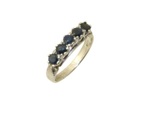 A sapphire five stone ring, the circular shape sapphire line with tapered shoulders, ring size Q, gross weight 3.2g. Conditio