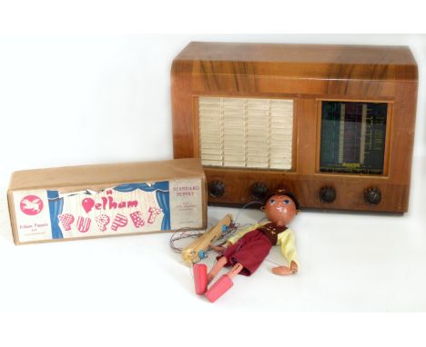Regentone walnut cased radio and a Pelham puppet. Condition reports are not available for our Interiors Sale
