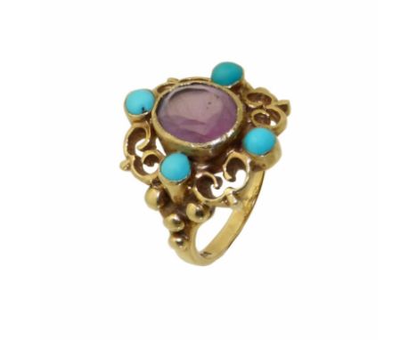 A 9ct gold paste and turquoise dress ring, the circular shape purple paste with a circular turquoise cabochon surround, hallm