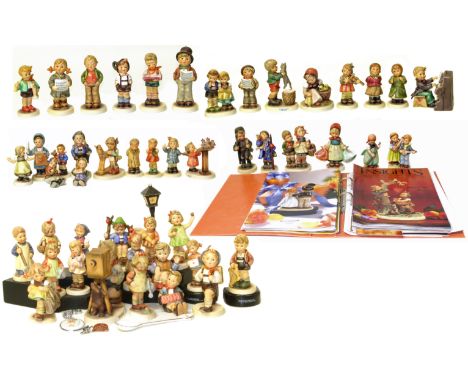 Forty eight Hummel (Goebel) figures with display strand, spoon, badges and paperwork Condition reports are not available for 