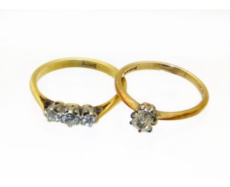 Two diamond rings, to include a diamond single stone ring together with a diamond three stone ring, stamped 18ct, ring sizes 