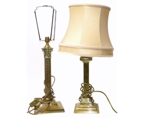 Two brass Corinthian column lamp bases. Condition reports are not available for our Interiors Sale