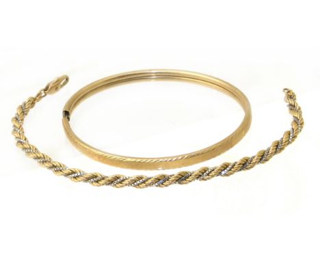 A 9ct gold bracelet, together with a 9ct gold bangle, gross weight 11.2g. Condition reports are not available for our Interio