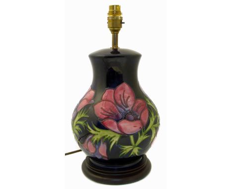 Moorcroft lamp base, blue ground anemone pattern, 26cm high. Condition reports are not available for our Interiors Sale
