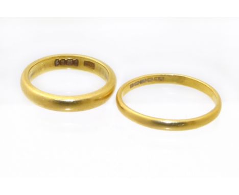 Two 22ct gold band rings, ring sizes K and N1/2, gross weight 7.1g. Condition reports are not available for our Interiors Sal