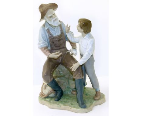 Lladro figure of a Boy and Father fishing. Condition reports are not available for our Interiors Sale