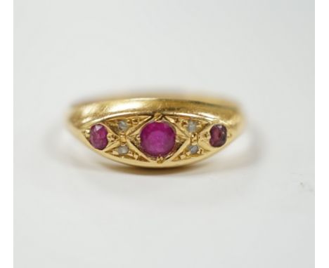 A George V 18ct gold,  three stone ruby and four stone diamond chip set ring, size K, gross weight 2.4 grams.