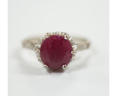 A 750 white metal and solitaire ruby set ring, size M/N, gross weight 3.1 grams.