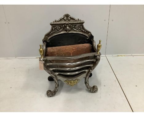 A George III style brass mounted cast iron and polished steel serpentine fire grate, width 46cm