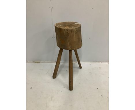 A Provincial trunk section chopping block on tripod stand, height 76cm