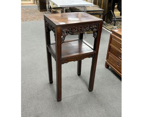 A Chinese rectangular hardwood two tier vase stand, width 41cm, depth 34cm, height 80cmMissing a section of carving to the un