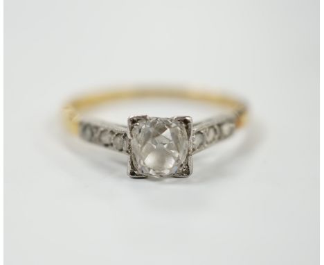 A 1920's yellow metal and single stone old mine cut diamond set ring, with six stone diamond set shoulders, size K/L, gross w