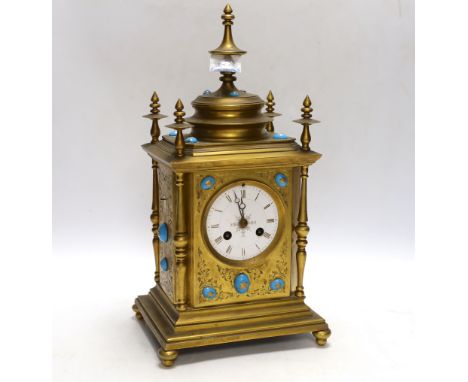 A brass French mantel clock (missing bell and pendulum), 35cm high