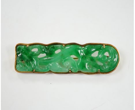 A Chinese 14k yellow metal and carved jade set rounded rectangular brooch, 63mm, gross weight 18.8 grams.