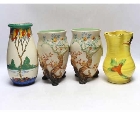 A pair of Clarice Cliff pottery vases, Ducal vase and a jug, largest 23cm high