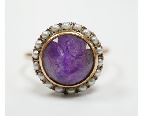 A mid 20th century 14k yellow metal, amethyst and seed pearl set circular cluster ring, size U/V, gross weight 4.3 grams.