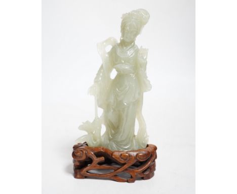 A Chinese celadon jade figure of a lady on wood stand,13cms high. Good condition, including stand.