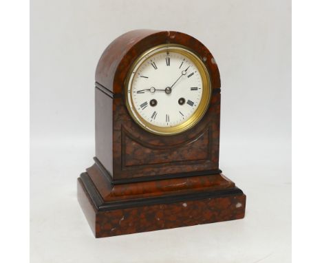 A late 19th century French rouge marble mantel clock, striking on a bell, with key,  24cm high