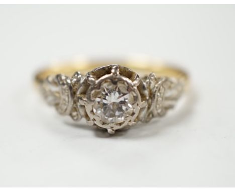 A yellow metal and illusion set solitaire diamond ring, size O, gross weight 3.8 grams.