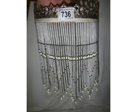A glass beaded lamp shade, 21 cm diameter, 28 cm long.