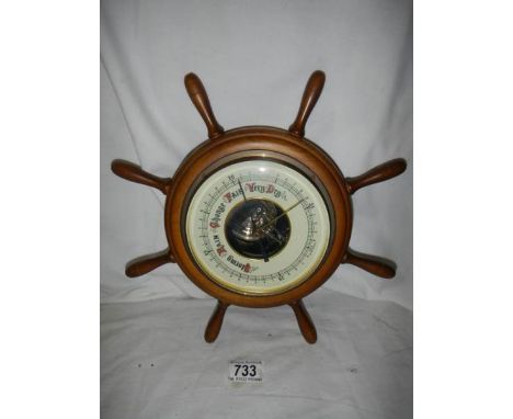 A barometer in the shape of a ship's wheel, 30 cm diameters.