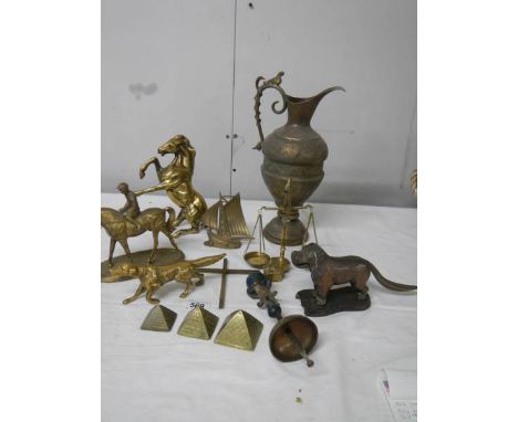 A mixed lot of brassware including dog nut cracker, rearing horse, dog, balance scales etc.,