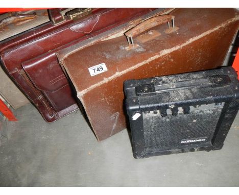 A small vintage suitcases a leather briefcase &amp; an amplifier