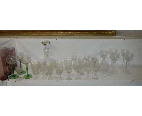 A modern decanter and various drinking glasses.