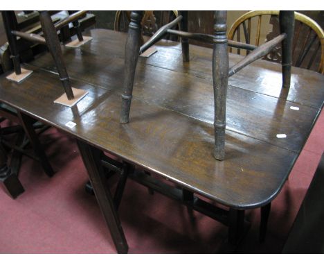 A Slender Elongated Drop Leaf Gateleg Table, in the Ercol manner, initialed MA ?  