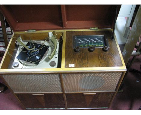 A Mid XX Century Walnut Cased Radiogram, record player with a hinged lid, two speakers over cupboard doors. 