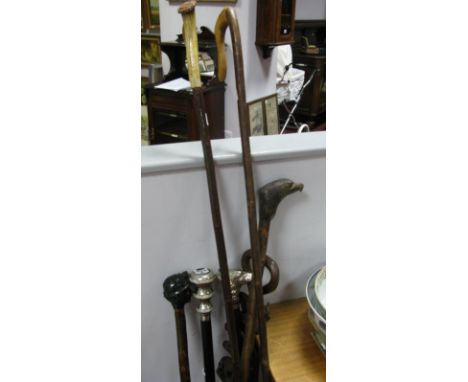 An African Style Hardwood Walking Stick, carved with animals; walking stick with miners head "Doug of Silverwood"; another wi