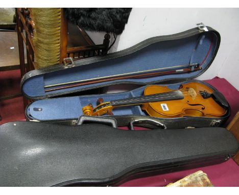 A XX Century Violin, two-piece back, internal label reads 'Rumania', cased, with bow; an empty violin case. (2)