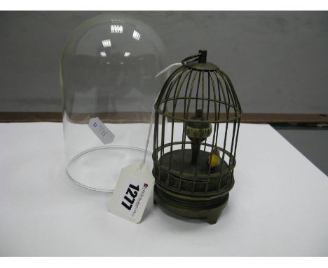 A Modern Brass Musical Automaton Clock, as a canary in cage in the Edwardian manner, approximately 12.5cm high, under glass d