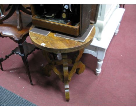 A Heavy Oak Occasional Table, circular top, on shaped tripod legs, in the Continental style, with stretchers.