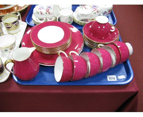 A Wedgwood Bone China Tea Service, pink coloured with sponge decoration (twenty five pieces approximately):- One Tray